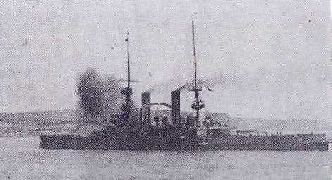 HMS Swiftsure firing at the Daradenelles in support of landings on 25 April 1915.