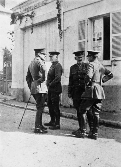 John Gough, second from right, talking to Brigadier-General E M Percival. Also in the picture are Lieutenant-General Douglas Haig and Major-General Charles Monro. France, 1914.
