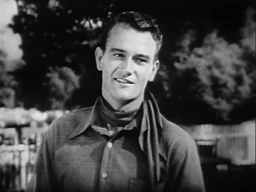 John Wayne as “Singin’ Sandy” Saunders in Riders of Destiny (1933).