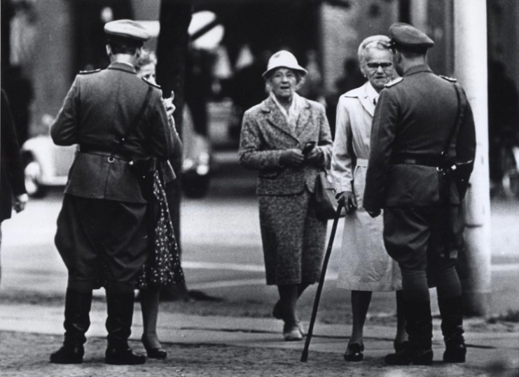 Late August 1961. East German police officers check the documents of East Berliners trying to pass from Potsdamer Platz to West Berlin.