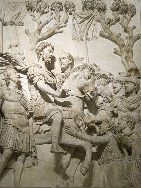 Marcus Aurelius receiving the submission of the vanquished, with raised vexillum standards