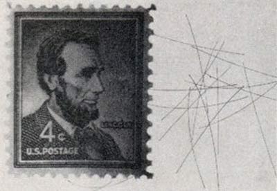 Needles from the West Ford project compared to a stamp.