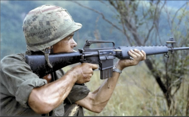 PFC Mendoza, a rifleman with “A” Company, 2nd Battalion, 502nd Infantry, 101st Airborne Brigade fires is M-16 rifle into a suspected Viet Cong occupied area.