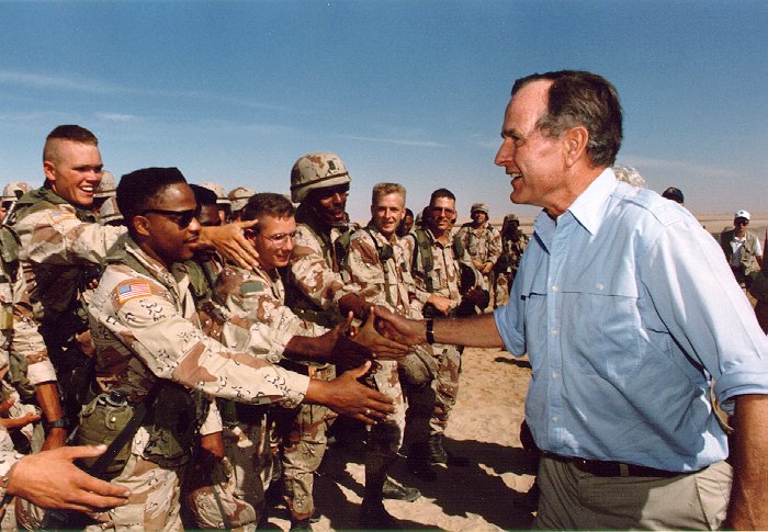 President Bush visiting American troops in Saudi Arabia on Thanksgiving Day, 1990.