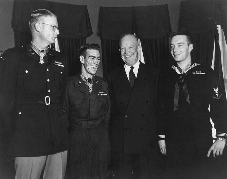 Charette stands with two other Medal of Honor recipients shortly after receiving their medals from President Dwight D. Eisenhower in 1954. From left: Edward R. Schowalter, Jr., Ernest E. West, Eisenhower, and Charette