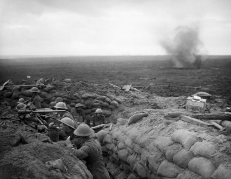 A signals section of the 13th Battalion, Durham Light Infantry, equipped with telescopes, field telephone and signalling lamps, await news of the progress of the unit’s attack towards Veldhoek during the Battle of Menin Road.