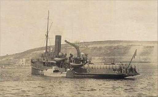 Photograph of the minelayer Nurset off the village of Maydos. Naval mines are visible on the back beach. Two of its mines sank the UK’s Irresistible battleships on March 18, 1915.