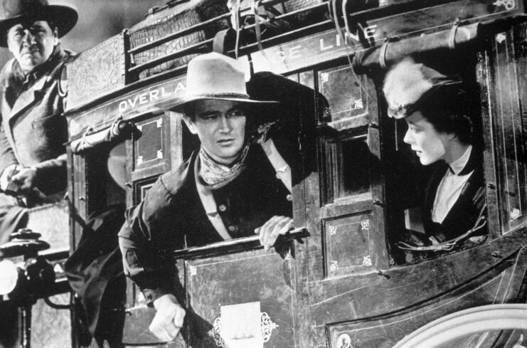 George Bancroft, John Wayne and Louise Platt as Marshal Curly Wilcox, the Ringo Kid and Lucy Mallory in 'Stagecoach'