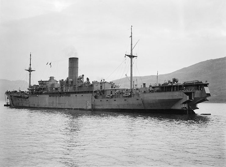 The auxiliary minelayer HMS MENESTHEUS, a converted Mercantile ship moored at a minelaying base on the Kyle of Lochalsh.
