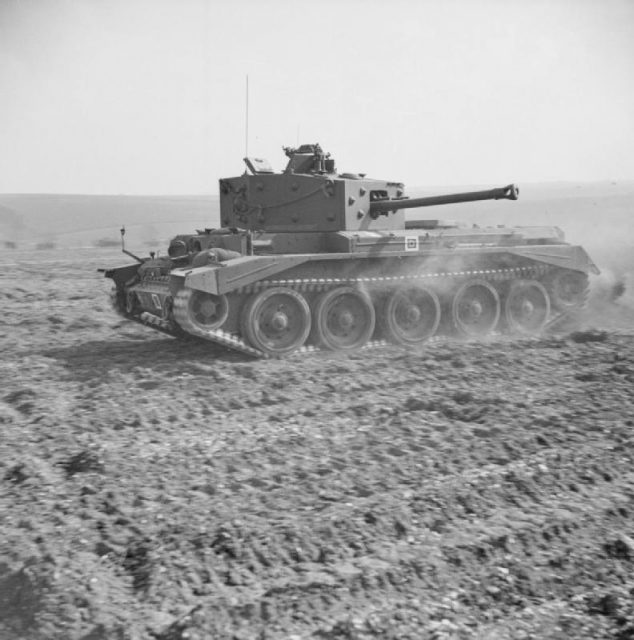 A Cromwell Mk IV of No. 2 Squadron, 2nd (Armoured Reconnaissance) Battalion, Welsh Guards, at Pickering in Yorkshire, March 31, 1944, displays its speed during an inspection by Winston Churchill.