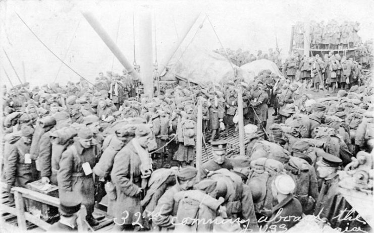 Troops of the 32nd (Division ?) coming on board the ship at Brest, France, for passage home to the United States, 1919. They are disembarking from a steam lighter, which is either Nenette or Rin Tin Tin.