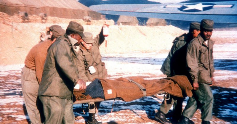 U.S. Airmen move a wounded patient during the Korean War. Speedy evacuation by air cut the casualty death rate by half since World War II. (U.S. Air Force photo)