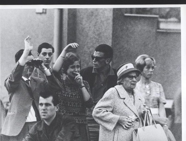 West Berliners, October 1961. West Berliners look over the border at loved ones left behind in East Berlin.