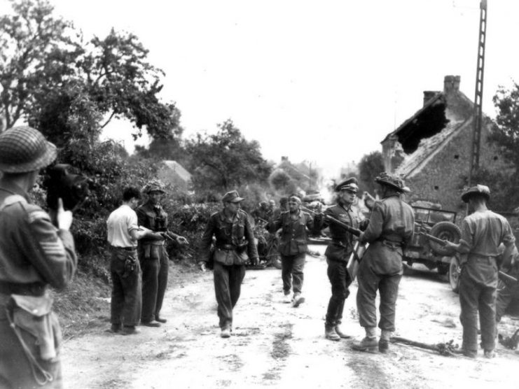 Major David Currie VC at St Lambert Sur Dives in an iconic photograph showing him in the midst of earning the Victoria Cross. Read more here: Victoria Cross Citation.