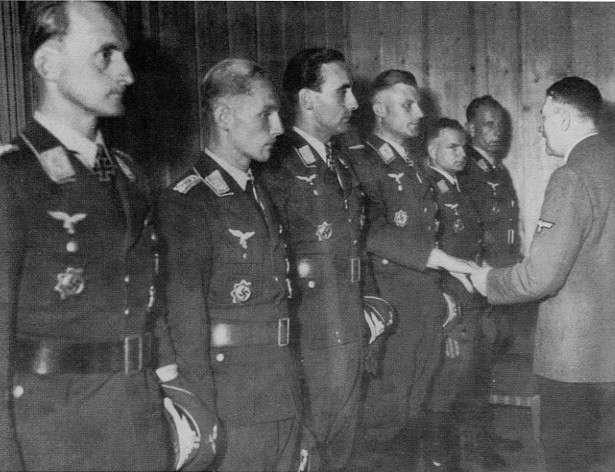 Friedrich Lang, then-Hauptmann Erich Hartmann and Heinz-Wolfgang Schnaufer receive the Oak Leaves with Swords, Horst Kaubisch, Eduard Skrzipek and Adolf Glunz the Oak Leaves to the Knight’s Cross from Adolf Hitler