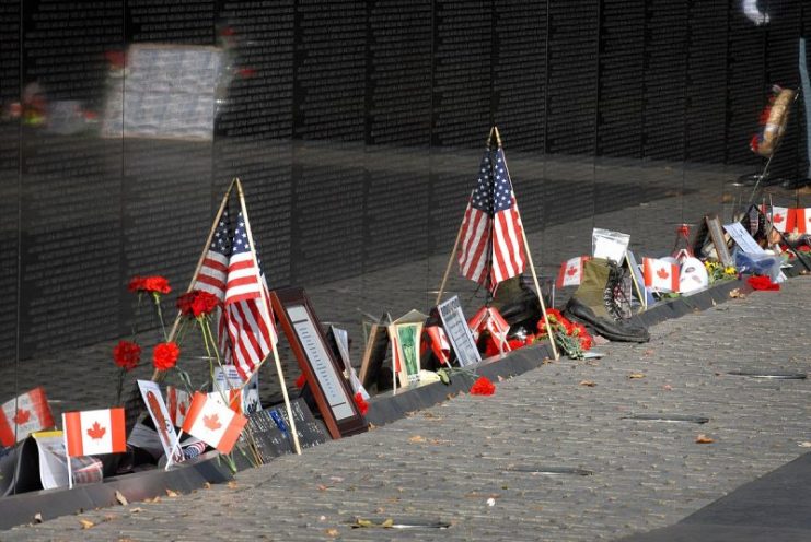 Visitors placed flowers, cards, flags and wreaths at the Vietnam War Memorial during a Veterans Day observance ceremony in Washington, D.C., Nov. 11, 2008.