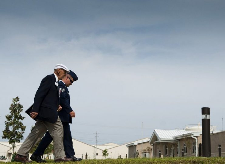 Retired Lt. Col. Dick Cole is escorted into a ceremony where an airplane hangar was dedicated to a fellow Doolittle Raider, retired Lt. Col. Ed Saylor, April 17, 2013, on Eglin Air Force Base, Fla. Photo: U.S. Air Force by Staff Sgt. David Salanitri