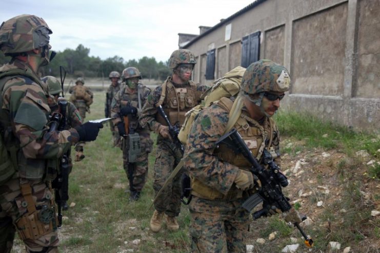 Marines and sailors with Special-Purpose Marine Air-Ground Task Force Crisis Response and Legionnaires from the 2nd Foreign Infantry Regiment of France’s 6th Light Armored Brigade work side-by-side during a simulated heliborne raid.Photo: Cpl. Michael Petersheim