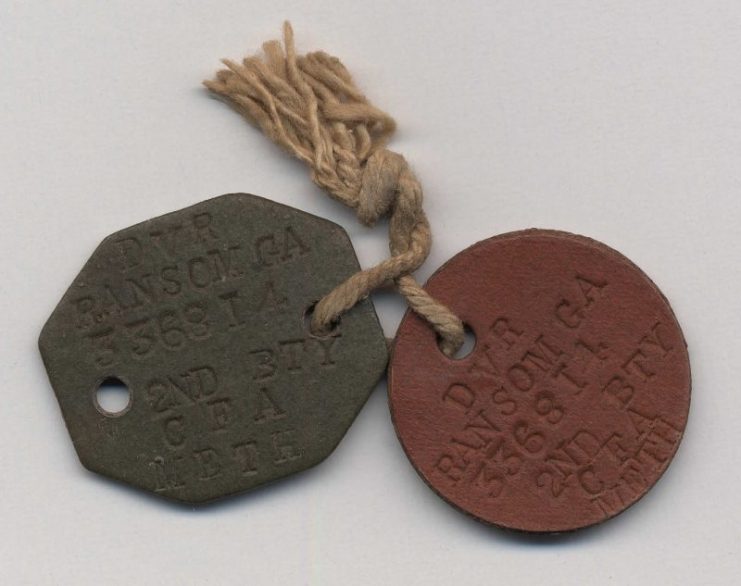 These identity discs belonged to Driver George Aaron Ransom of the 2nd Howitzer Battery, Canadian Field Artillery. He was killed during the Battle of Passchendaele on 6 November 1917 at the age of 24. He is buried at Brandhoek Cemetery, Belgium.