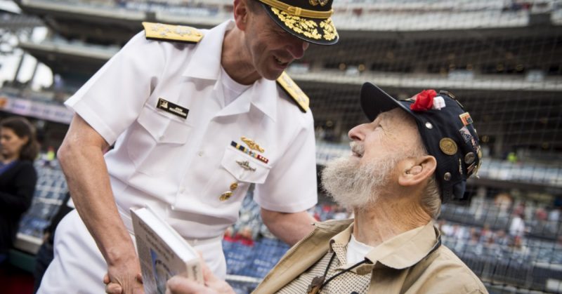 Chief of Naval Operations (CNO) Adm. John Richardson talks with Bill Dawson, the last surviving member of the very first Naval Combat Demolition Unit (NCDU) during Navy appreciation night at Nationals Park. NCDUs were the precursor of the Underwater Demolition Teams (UDT) and today’s Navy SEALs. (U.S. Navy photo by Mass Communication Specialist 1st Class Nathan Laird/Released)