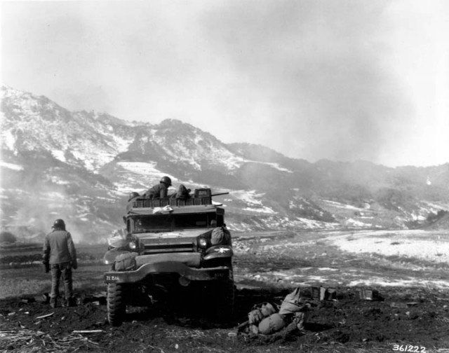 American half-track firing at Chinese in Korea.
