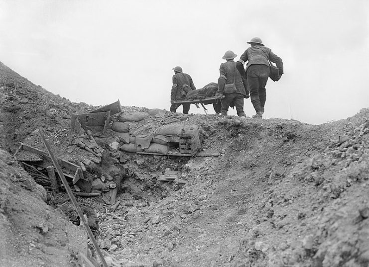 British stretcher bearers recovering a wounded soldier from a captured German trench during the Battle of Thiepval Ridge, late September 1916, part of the Battle of the Somme.