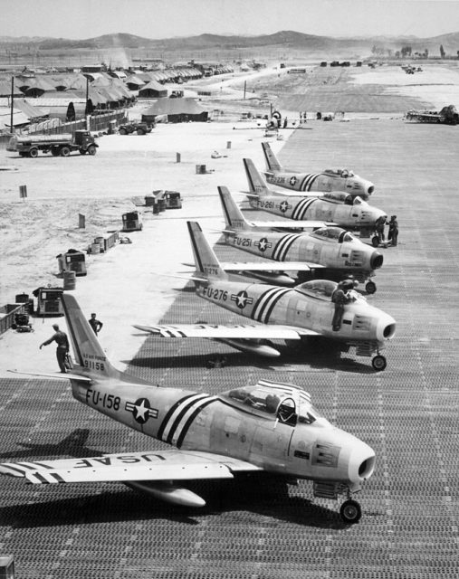 Five North American F-86A Sabre fighters of the 4th Fighter Interceptor Wing on the flight line at Suwon, South Korea, in June 1951