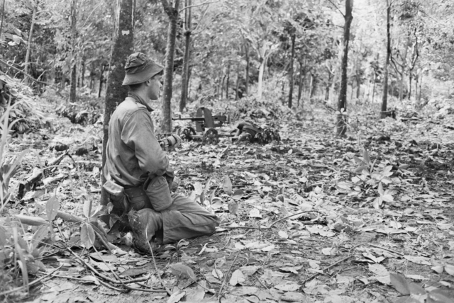 An Australian soldier on the Long Tan battlefield during 19 August. Photo: AWM.