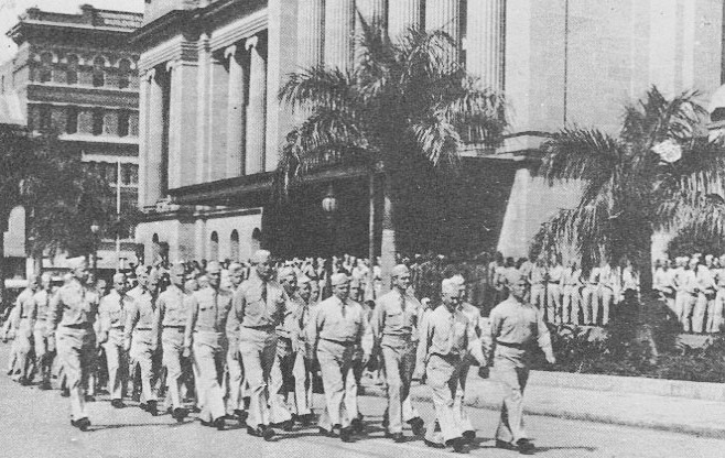 U.S. servicemen march through King George Square, Brisbane, circa 1943.