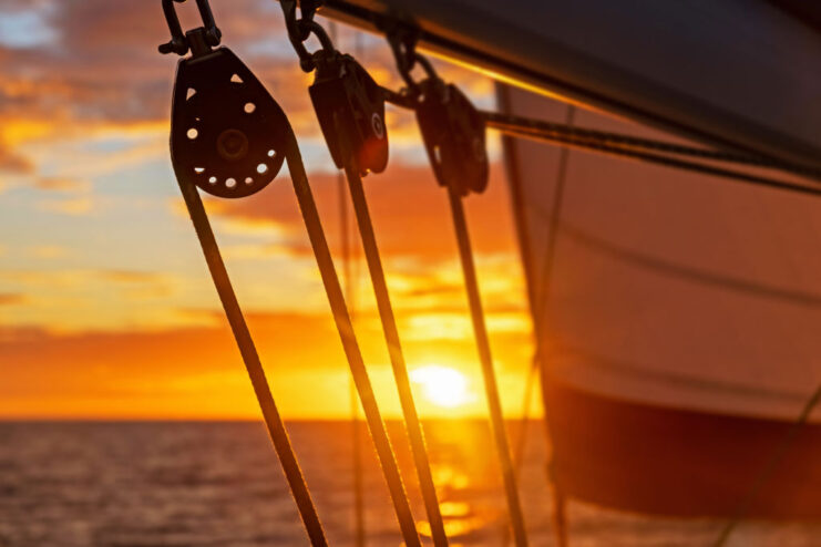 Sailing boat blocks at sunset