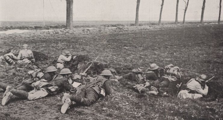 British and French soldiers aiming their rifles from a trench