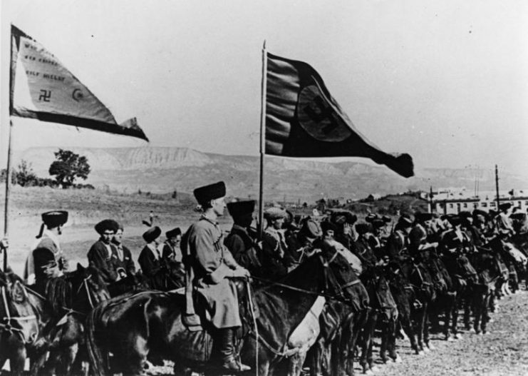 Cossacks in the Wehrmacht under the Swastika flag, 1942. South-western Soviet Union. Bundesarchiv, Bild 146-1975-099-15A / CC-BY-SA 3.0