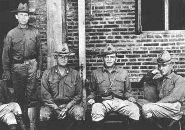 Butler (far right) with three other legendary Marines. From left to right: Sgt. Maj. John H. Quick, Maj. Gen. Wendell Cushing Neville, Lt. Gen. John Archer Lejeune