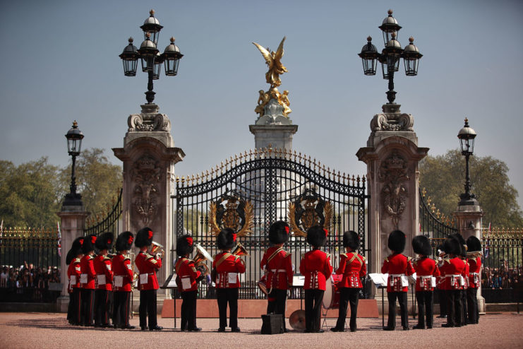 Coldstream Guards lined up at the front gate of Buckingham Palace