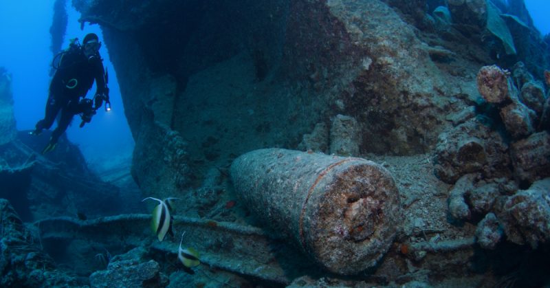 Scuba diver explores a shipwreck