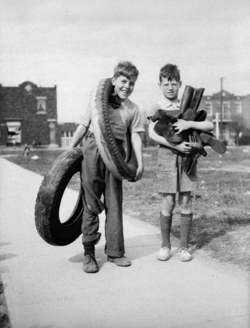 Two boys in the Rosemont neighbourhood gather rubber for wartime salvage. Montreal, Canada.Date 29 April 1942