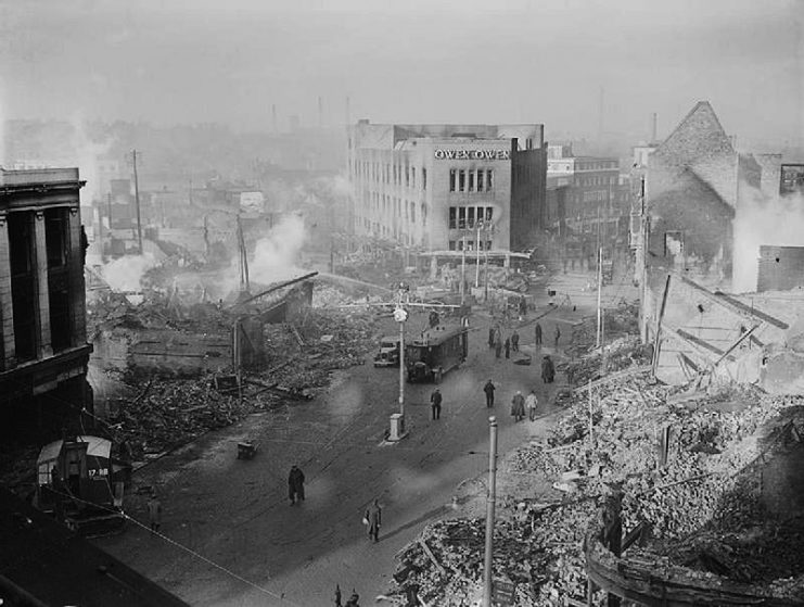 Broadgate in Coventry city centre following the Coventry Blitz of 14/15 November 1940. The burnt out shell of the Owen Owen department store (which had only opened in 1937) overlooks a scene of devastation.