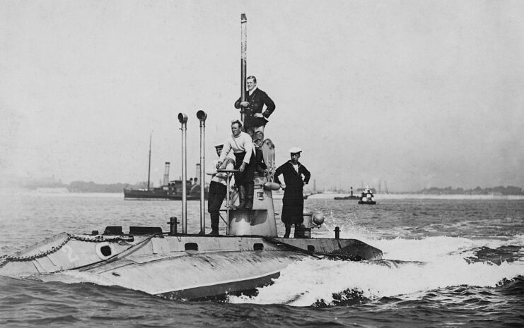 British Royal Navy sailors standing atop the HMS Holland 2 at sea