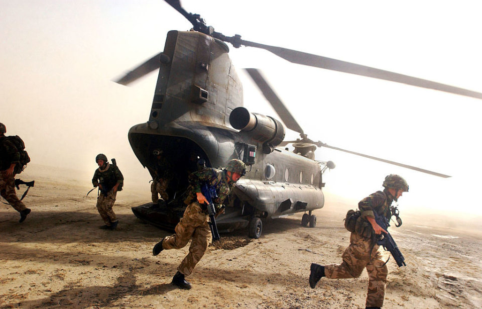 British Royal Marines running from a Boeing CH-47 Chinook