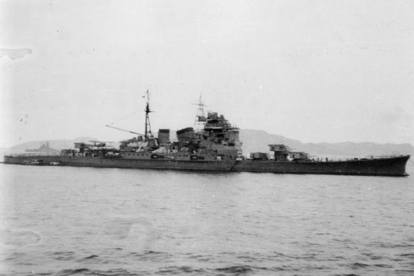 Chōkai at anchor at Truk, November 20, 1942. Battleship Yamato can be seen in the left background.