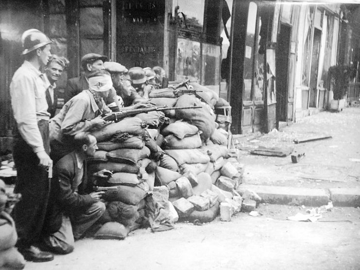 Liberation of Paris, France, August 25, 1944. Parisian Men fighting during the liberation.