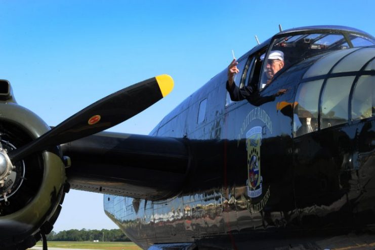 Lt. Col. Dick Cole, a Doolittle Raider, smiles while looking out of a B-25 aircraft April 20, 2013, on the Destin Airport, Fla. The B-25 is the aircraft he co-piloted during the Doolittle Raid. Air Force photo // Staff Sgt. David Salanitri