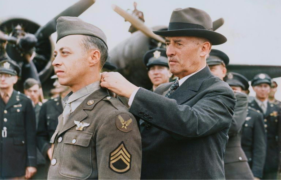 Henry L. Stimson placing the Medal of Honor around Maynard Harrison Smith's neck