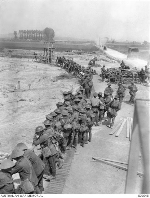 Soldiers studying the large contour map specially constructed between Petit Pont and Nieppe, constructed to give the troops a knowledge of the Messines battlefield.