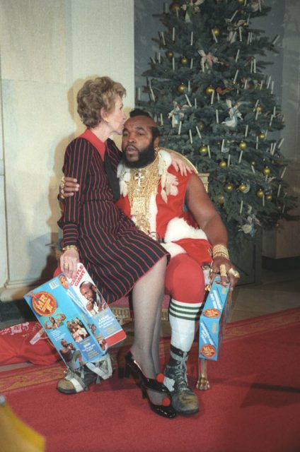 Mr. T portrays Santa Claus at the White House with First Lady Nancy Reagan in 1983.