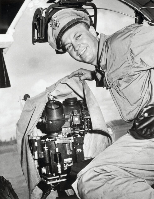 US Army officer lifting a covering from over a Norden bombsight