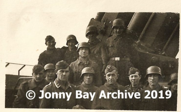 Bärwolf along with other gun crew members at the flak tower’s 128mm flak cannons. © Jonny Bay Archive 2019