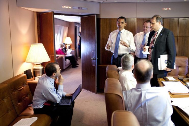President Barack Obama meets with staff mid-flight aboard Air Force One, in the conference room, 3 April 2009.