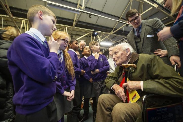 Maj Gen Stuart Watson, 13th/18th Royal Hussars, with schoolchildren from Bovington Primary School