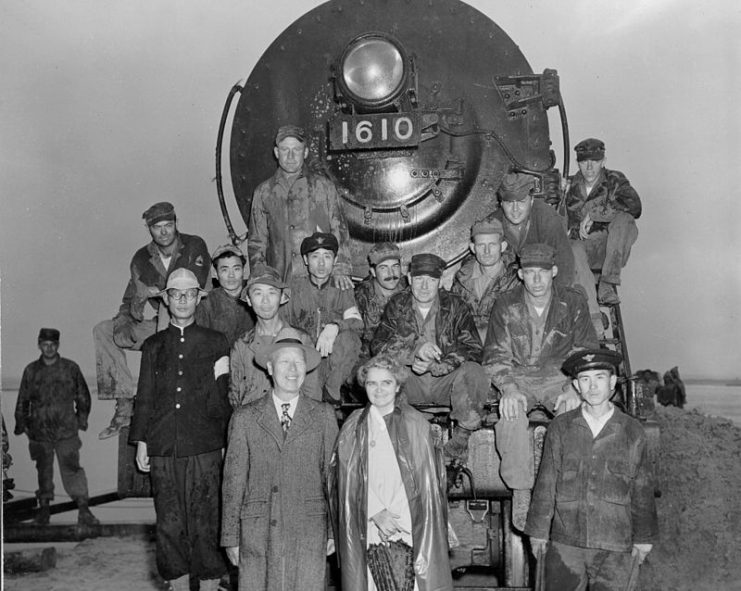 Rhee and his wife posing with Army Corps of Engineers personnel in 1950 at the Han River Bridge.
